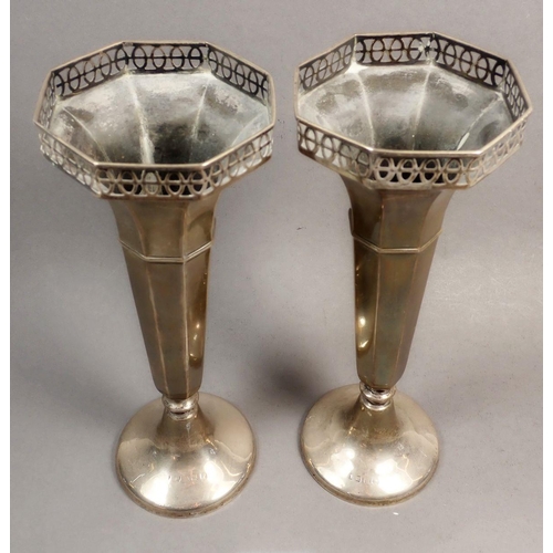 190 - A pair of silver fluted vases with pierced decoration, Birmingham, marks rubbed, weighted, approx 22... 