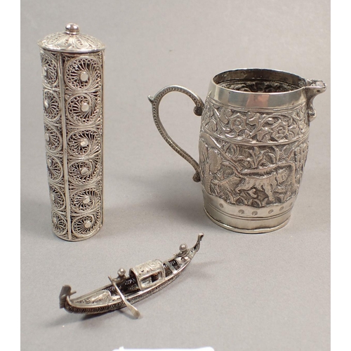 197 - An Indian white metal cream jug, a filigree junk and a cylindrical box