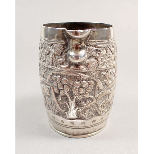 197 - An Indian white metal cream jug, a filigree junk and a cylindrical box