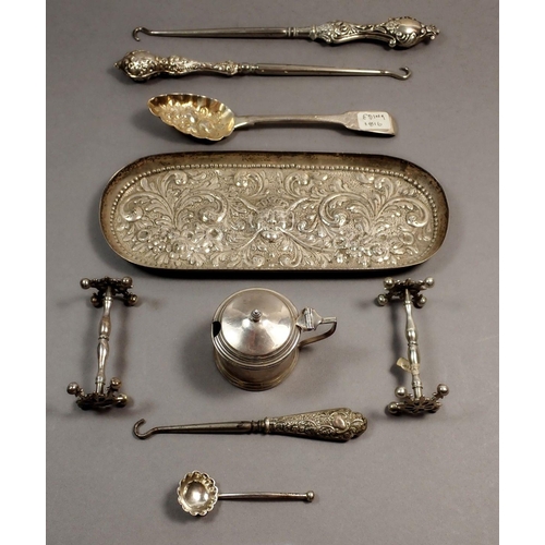 204 - A silver embossed trinket tray with embossed bacchus decoration, London 1890, 85g and three silver b... 