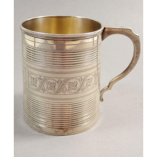 223 - A Victorian silver tankard, engraved vines and presentation,  in fitted leather case, London 1883, 1... 