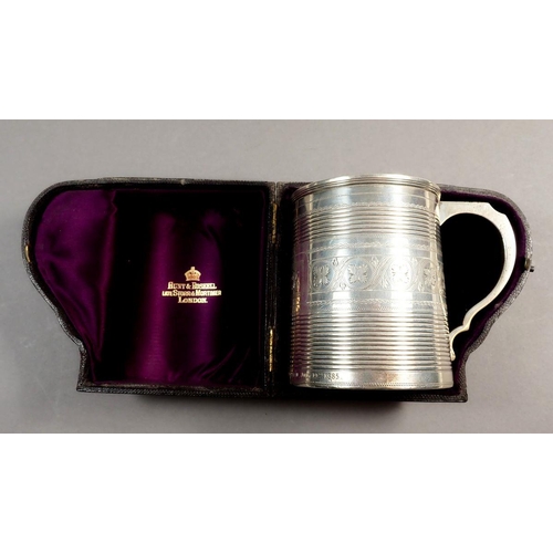 223 - A Victorian silver tankard, engraved vines and presentation,  in fitted leather case, London 1883, 1... 