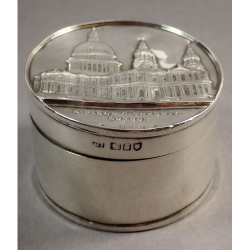 224 - A silver box with St Paul's Cathedral to the cover and base, London 1897, 5.7cm diameter