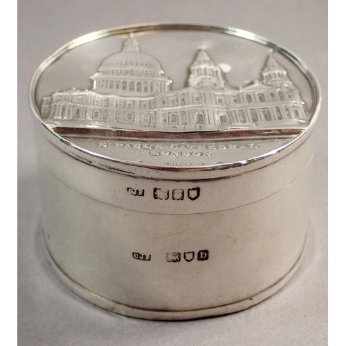 224 - A silver box with St Paul's Cathedral to the cover and base, London 1897, 5.7cm diameter