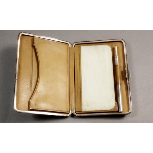 226 - A Victorian silver note case with engraved floral decoration, fitted interior with a pencil and ivor... 