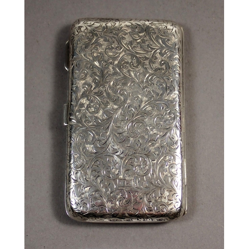 231 - A George V silver notecase with scroll decoration and fitted interior with pencil and ivory insert, ... 