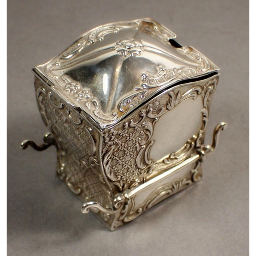 234 - A silver novelty mustard pot in the form of a sedan chair, with embossed decoration and green glass ... 