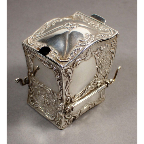 234 - A silver novelty mustard pot in the form of a sedan chair, with embossed decoration and green glass ... 