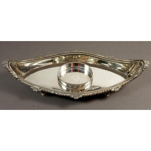 242 - A late Victorian silver inkstand of lozenge shape, raised on four feet with singe cut glass bottle a... 