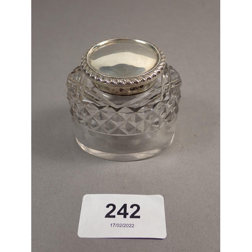 242 - A late Victorian silver inkstand of lozenge shape, raised on four feet with singe cut glass bottle a... 