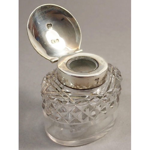 242 - A late Victorian silver inkstand of lozenge shape, raised on four feet with singe cut glass bottle a... 