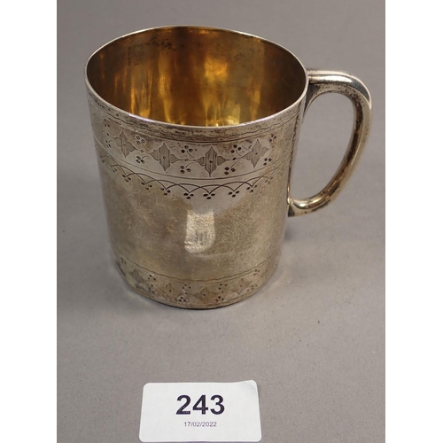 243 - A Victorian silver mug with engraved decoration, London 1871 by Thomas Smily, 147g 8cm tall