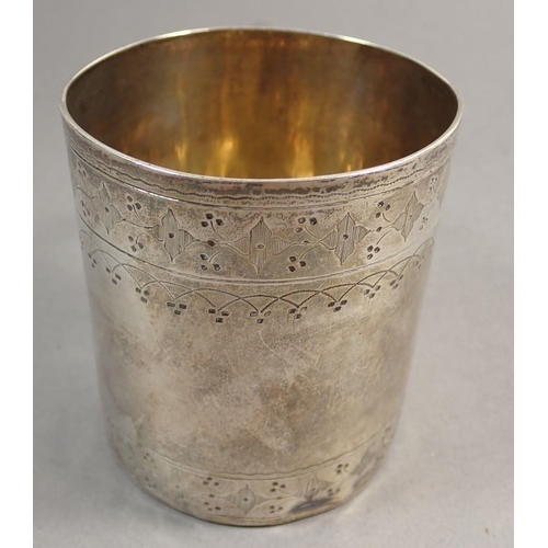 243 - A Victorian silver mug with engraved decoration, London 1871 by Thomas Smily, 147g 8cm tall