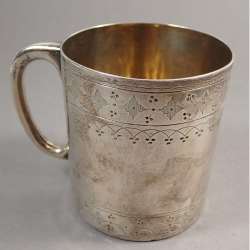 243 - A Victorian silver mug with engraved decoration, London 1871 by Thomas Smily, 147g 8cm tall