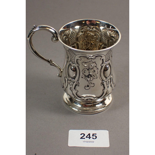 245 - A Victorian silver christening mug with embossed floral pendants, London 1848 by George Richards, 8c... 