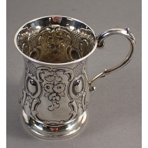 245 - A Victorian silver christening mug with embossed floral pendants, London 1848 by George Richards, 8c... 