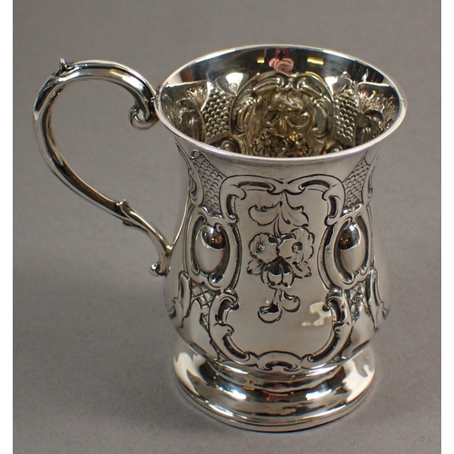 245 - A Victorian silver christening mug with embossed floral pendants, London 1848 by George Richards, 8c... 