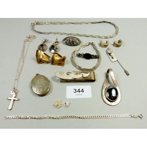 344 - A selection of silver jewellery to include a silver hallmarked locket, a large pendant stamped AMAPO... 