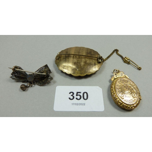 350 - A 19th century mourning brooch, a 9ct gold back and front locket and a white metal filigree bow broo... 