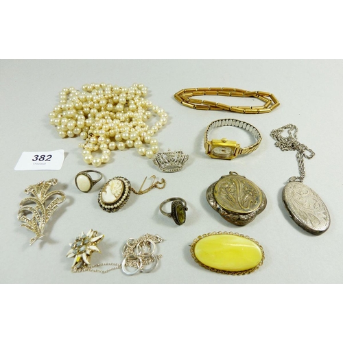 382 - A box of costume jewellery including silver locket, marcasite rings etc