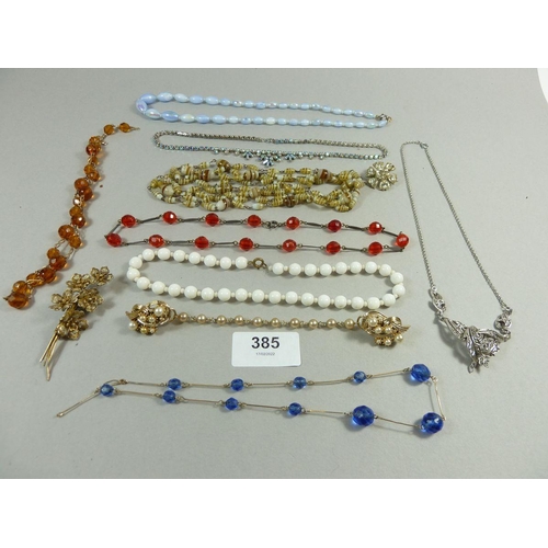 385 - A quantity of vintage costume jewellery to include bead necklaces, brooches etc