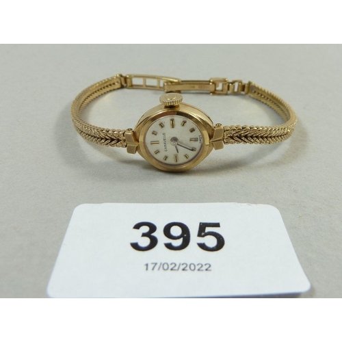 395 - A Caravelle 9 carat gold ladies watch on 9 carat gold strap