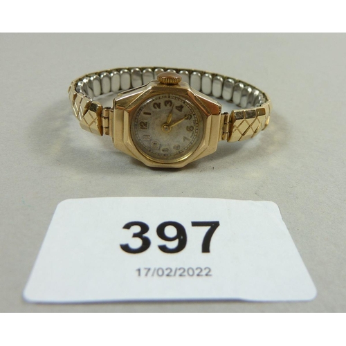 397 - A 9 carat gold ladies wrist watch on gold plated strap