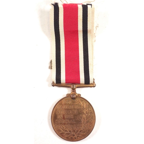 422 - A Special Constabulary medal and badge for Glamorgan to Lewis J Hughes