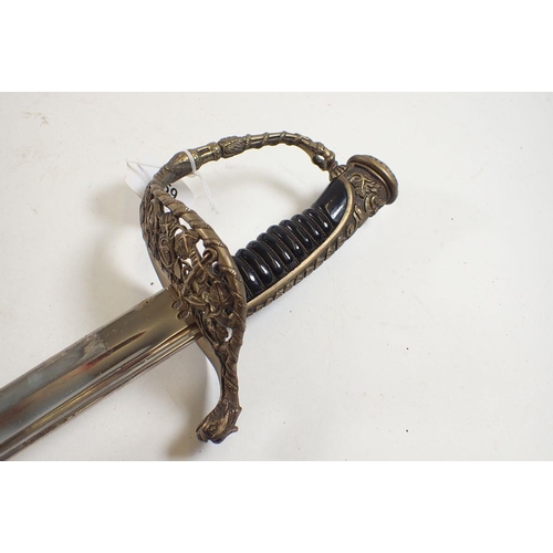 459 - A French naval sword with pierced and cast decoration and leather scabbard, blade measures 70cm