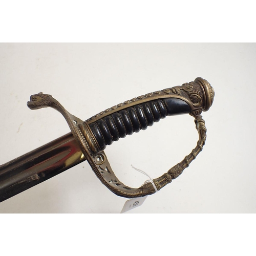 459 - A French naval sword with pierced and cast decoration and leather scabbard, blade measures 70cm