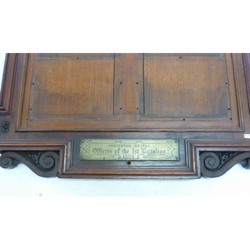 485 - A large officers carved mahogany notice board with brass plaque 'Presented by the Officers of the 1s... 