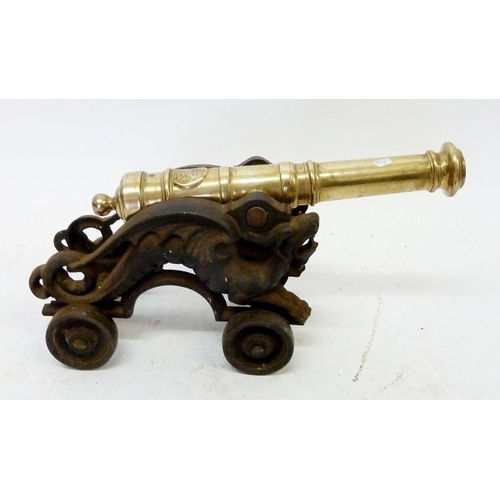 492 - A 19th century brass and cast iron artillery cannon, 45cm total length