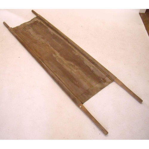 493 - A WWII military canvas stretcher with carrying poles