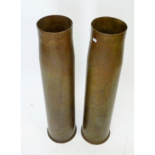 494 - Two 1981 105mm brass shell cases, approx 65.5cm high