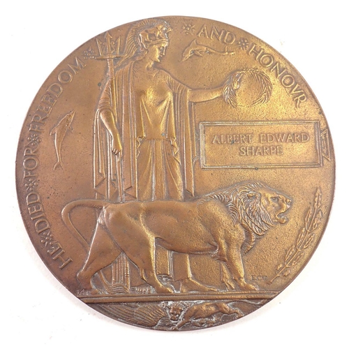 501 - A WWI bronze memorial death plaque to Albert Edward Sharpe, Royal West Kent Regiment with cardboard ... 