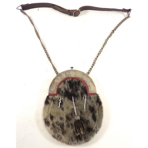 507 - A Scottish seal fur sporran with silver-plated fittings and strap