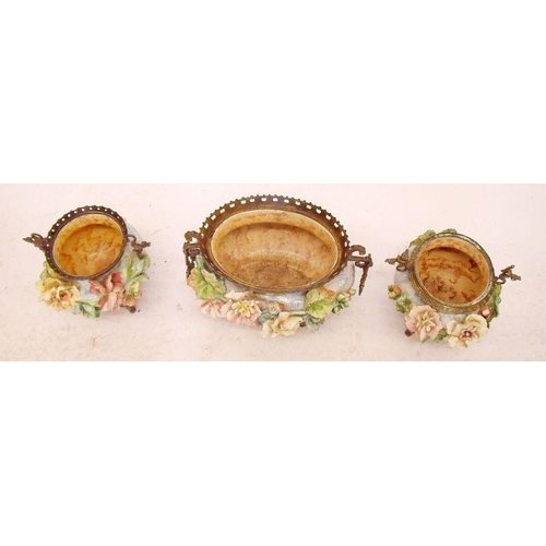 52 - A garniture of three large pottery jardinieres with applied floral decoration and elaborate gilt met... 