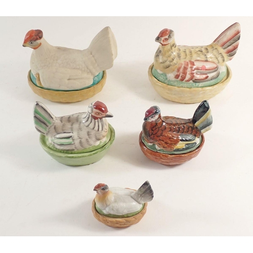 87 - Five early 20th century small chicken on basket egg holders, largest 15cm long