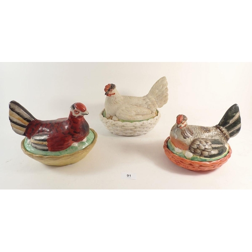 91 - A Victorian pheasant on a basket egg holder and two chicken on baskets, largest 24cm wide