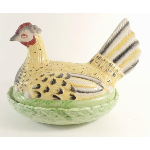 93 - A large early 20th century chicken on a basket egg holder, 31cm wide