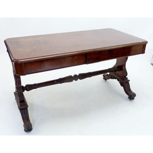 941 - A Victorian mahogany library table with carved end supports