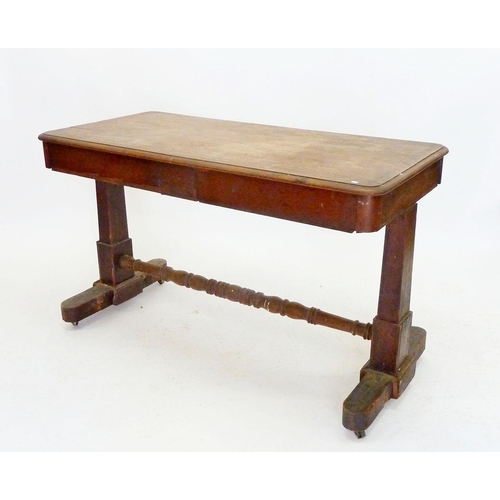 944 - A Victorian mahogany library table with end supports and turned stretcher, 122 x 60cm