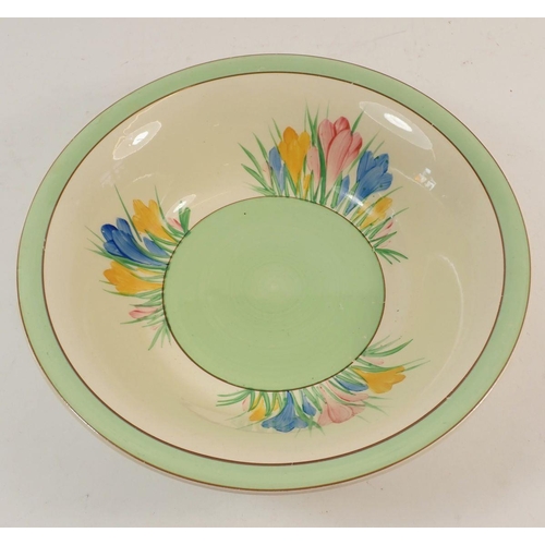 98 - A Clarice Cliff Newport pottery fruit bowl painted in the Crocus Pattern with green banded border, 2... 