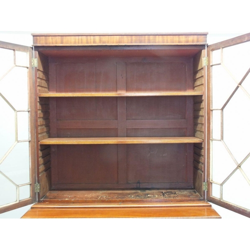 934 - A 19th century mahogany secretaire bookcase with two glazed doors over associated base with secretai... 