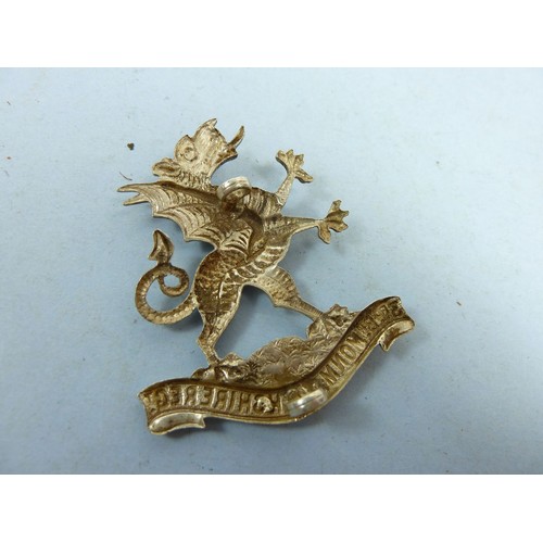 414 - A 9th Battalion Highland Light Infantry cap badge and other cap badges