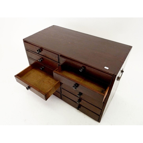 1261 - A 19th century twelve drawer mahogany collectors cabinet set on bun feet with ebonised knobs and two... 