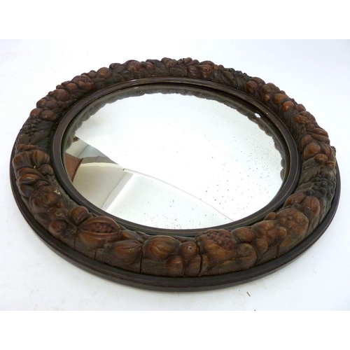 1262 - A large circular mirror carved fruit - 60cm diameter