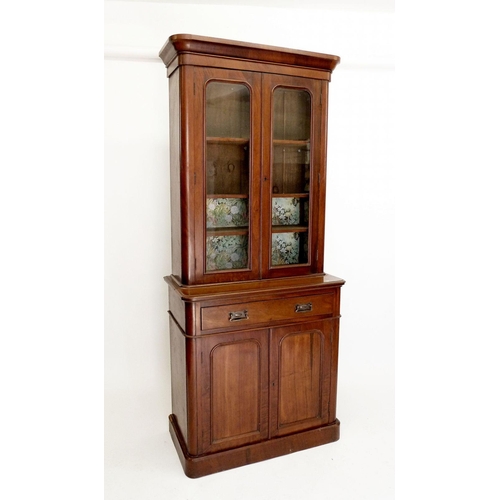 1273 - A Victorian small mahogany bookcase with two glazed doors over drawer and cupboard