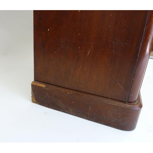 1273 - A Victorian small mahogany bookcase with two glazed doors over drawer and cupboard