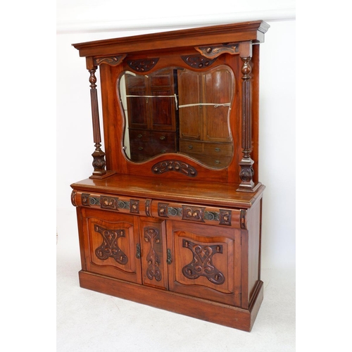 1279 - An Art Nouveau mirror back sideboard with ornately carved decoration of interwined stems and buds